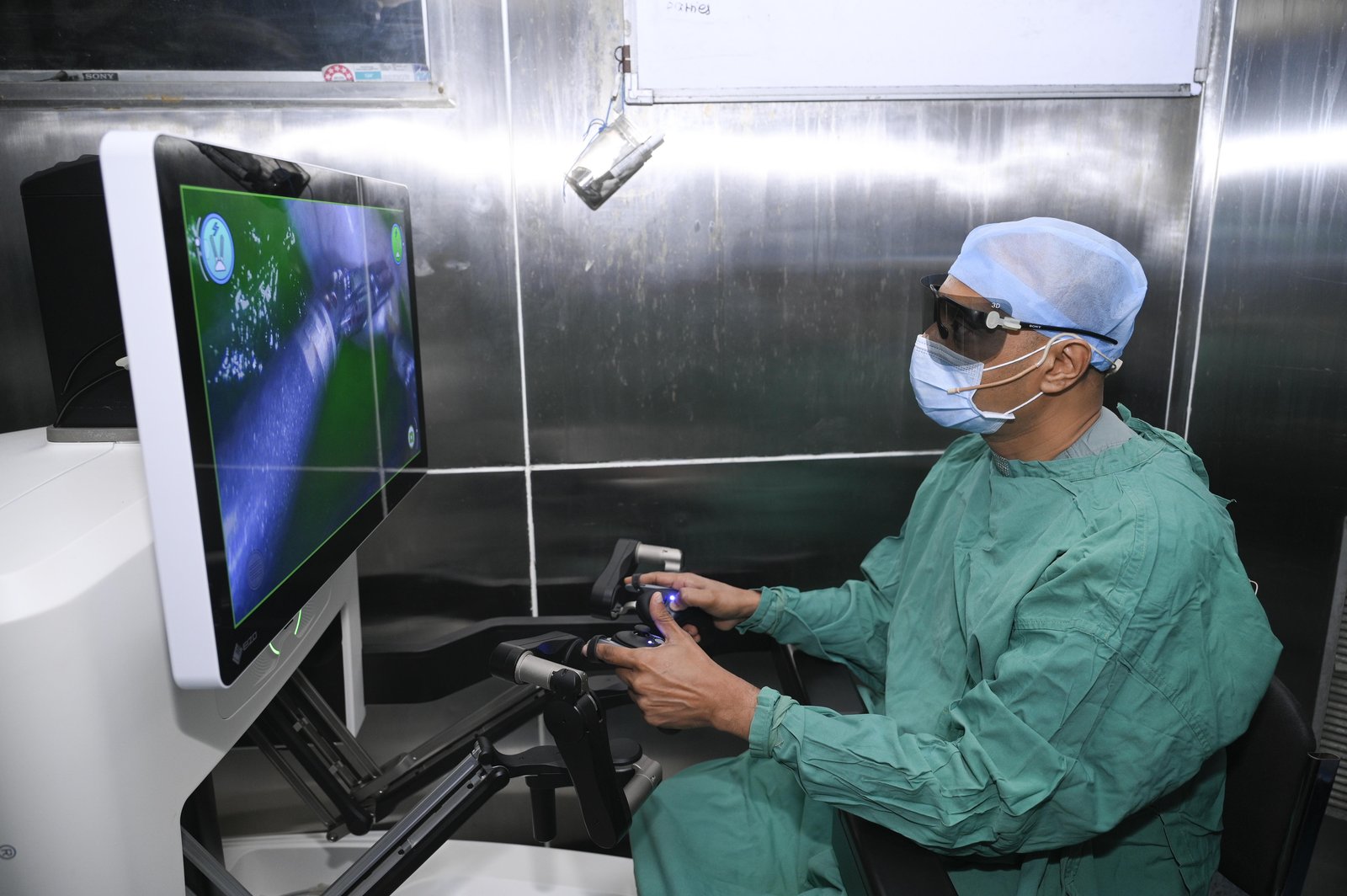 Dr Prasad Bhukebag operating at the 3D HD Robotic Surgical Console
